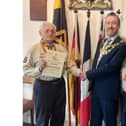 Photo shows John Hinks (left) with his wife Pam while receiving the award from the Mayor of Warwick, Cllr Oliver Jacques. Photo by Warwick Town Council.