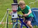 Youngsters providing the energy for their own smoothie drink