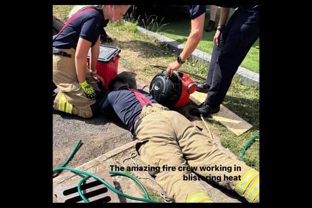 The firefighters from Leamington working in the heat to try to rescue Henry. Credit: Warwickshire Hedgehog Rescue