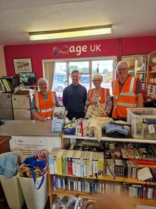 In the image, from left to right: Sylvia (volunteer), Reece McLarnon (Director of Services), Jayne (volunteer), Ron (volunteer)