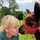 Lynsey gets up close and personal with one of her alpaca friends.