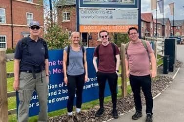 Rob Perkins, Alice Fish, Christy Mclean, and Dan Forrester from Bellway South Midlands’ land and planning team after completing their nine-mile charity walk from Staverton Lodge in Daventry to Houlton Meadows in Rugby