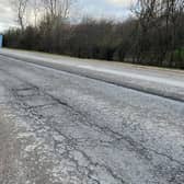 A broken surface on the side of the road and a deep ridge in the middle, this is the view from the Nortoft Lane junction back towards Houlton, just a small part of the problems on that stretch of the A428.