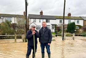 John Slinger MP, with local Wolston resident, Laurie Wright, during recent flooding in the New Year.