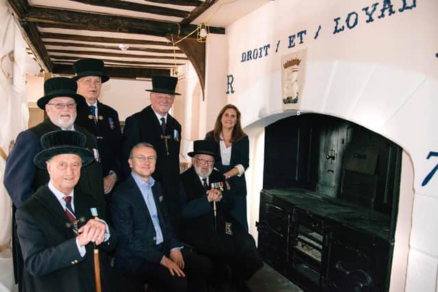 Lord Leycester Brethren, Iskender Diker, commercial director at Middleby Residential (Rangemaster) and Kathryn Lowe, marketing manager at AGA Rangemaster with the original Kitchener stove. Photo by Gill Fletcher
