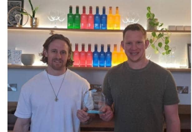 Richie Bartle on left, Luke Weetman on right with the award at East Chase Distillery. Photo supplied by East Chase Distillery