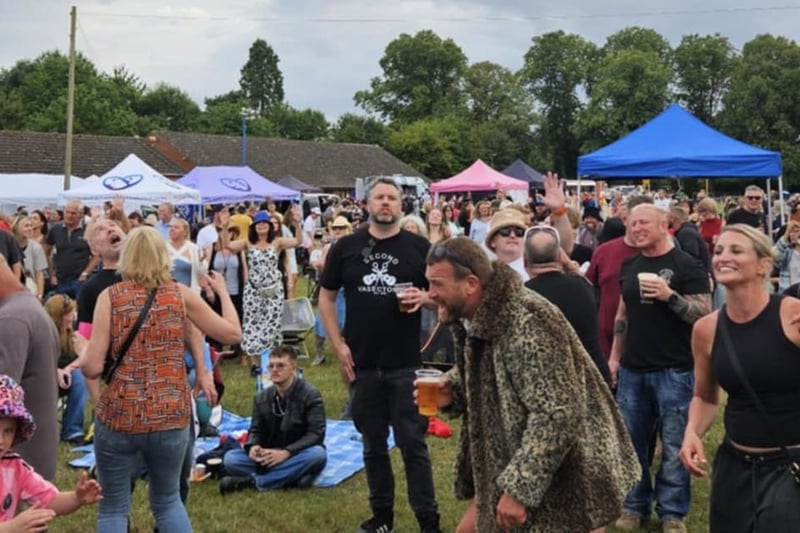 Crowds dance and enjoy the festival.