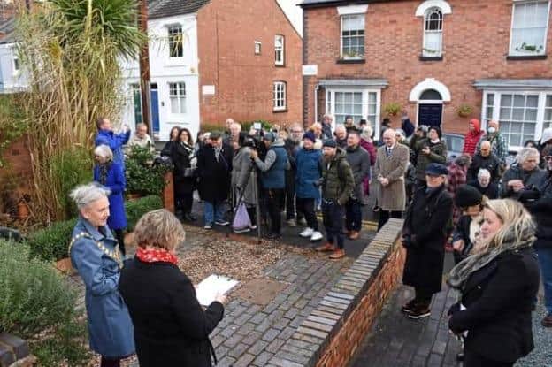 A crowd gathered for the unveiling of the plaque. Photo by Allan Jennings.