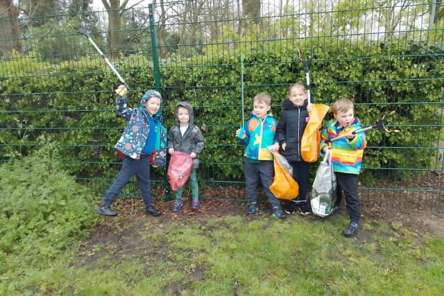 Pictured left to right are Long Itchington litter pickers Oliver, Henry, Joseph, Scarlett and Felix. Picture supplied.