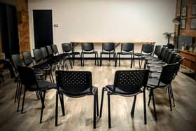 Men are invited to take a seat and support each other.