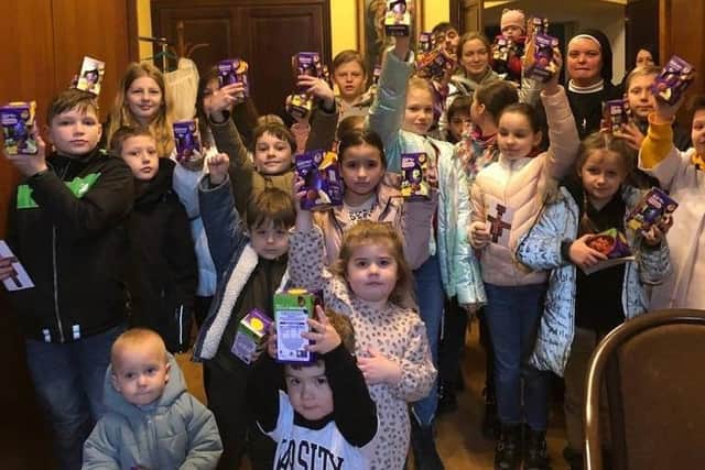Ukrainian children show the eggs donated to them by the Leamington appeal.