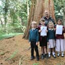 Pupils with Forest School Practitioner, Verity Clark in the school's Windmill Wood