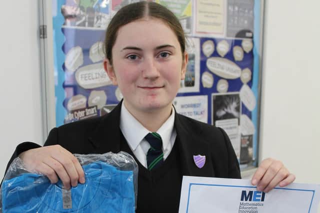 Eleanor Warren with her certificate and t-shirt
