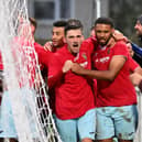 Provider Dan Summerfield and scorer Jordan Wilson celebrate Rugby Town's winner in the 3-2 success at Desborough Town. Picture by Martin Pulley