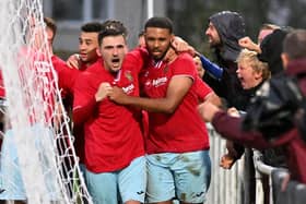 Provider Dan Summerfield and scorer Jordan Wilson celebrate Rugby Town's winner in the 3-2 success at Desborough Town. Picture by Martin Pulley