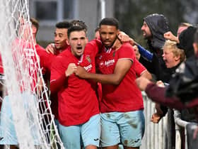 Provider Dan Summerfield and scorer Jordan Wilson celebrate Rugby Town's winner in the 3-2 success at Desborough Town. Picture by Martin Pulley