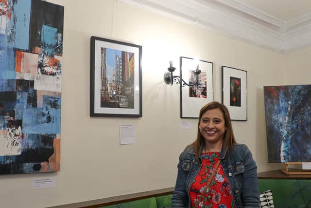 Photographer Mjay Mistry with her work. Picture: Mohini Mistry.