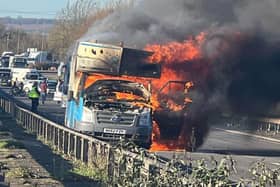 The chip van is pictured ablaze. The driver and passenger escaped shocked but unhurt