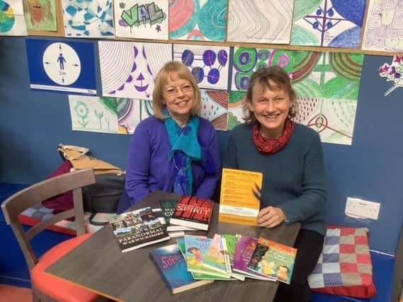Meg Harper and Sheila Robinson holding a Writing for Wellbeing class.