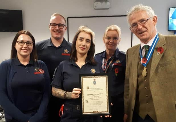 High Sheriff of Warwickshire David Kelham presents the Warwickshire Fire & Rescue Service team with a High Sheriff Award for ‘Great and valuable services to the community’.