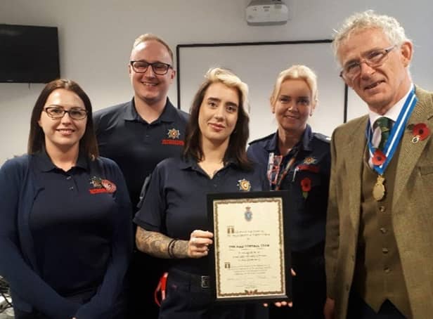 High Sheriff of Warwickshire David Kelham presents the Warwickshire Fire & Rescue Service team with a High Sheriff Award for ‘Great and valuable services to the community’.