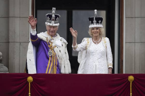 King Charles III and Queen Camilla wave to the crowds from the balcony at Buckingham Palace (Picture: Christopher Furlong/Getty Images)
