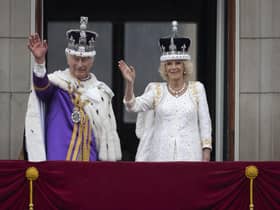 King Charles III and Queen Camilla wave to the crowds from the balcony at Buckingham Palace (Picture: Christopher Furlong/Getty Images)