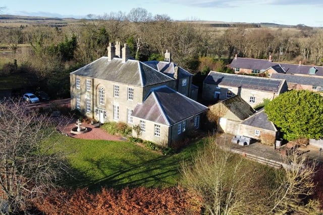 An aerial view of Newton Low Hall and its extensive grounds and outbuildings.