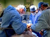 EMBARGOED TO 0001 MONDAY FEBRUARY 4 File photo dated 7/4/11 of an operation taking place. An extra 290,000 operations could be carried out on the NHS every year if the way theatre lists are managed was improved, a national review has found.