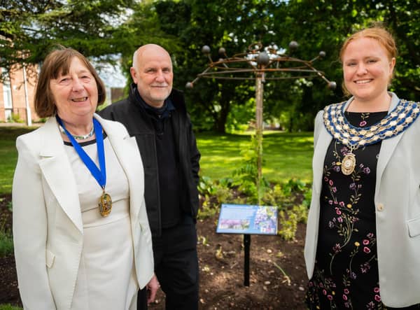 Sam Cooke (Mayor of Kenilworth), Jon Holmes (sculpture artist) and Sidney Syson (vice chair of Warwick District Council) conducted an unveiling of a new Covid sculpture to honour those who died in the pandemic, at Jubilee House.