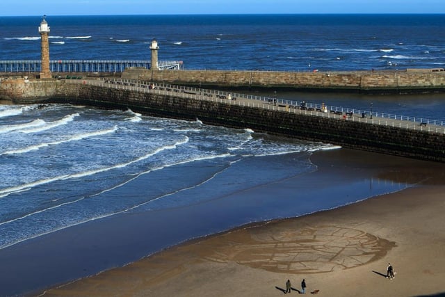 The coastal stretch of Whitby is also known as the ‘Dinosaur Coast’ or the ‘Fossil Coast’ as dinosaur footprints can be spotted in Whitby.

The petrified bones of a crocodile and a specimen of plesiosaurus measuring 15ft 6in in length and 8ft 5in in width were discovered in 1841.

The town is also popular for its wind surfing, sailing and surfing events that take place at the beaches between Whitby and Sandsend.

Whitby Beach has a rating of four and a half stars on TripAdvisor with 1,462 reviews.