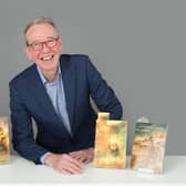 Dr Justin Newland with his novels. Photo by Christopher Alan.