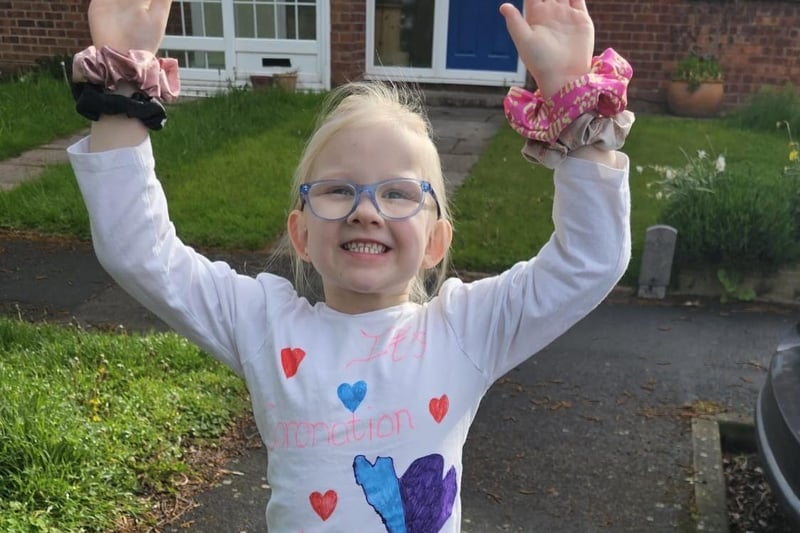 Clara Rose, age 5, made her own coronation t-shirt, with  "It's coronation day" and blue and red hearts