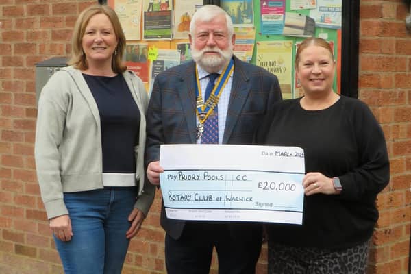 President Dick Dixon presenting £20,000 to Amanda Burford Chair of the PPCC and Viv. Bosworth