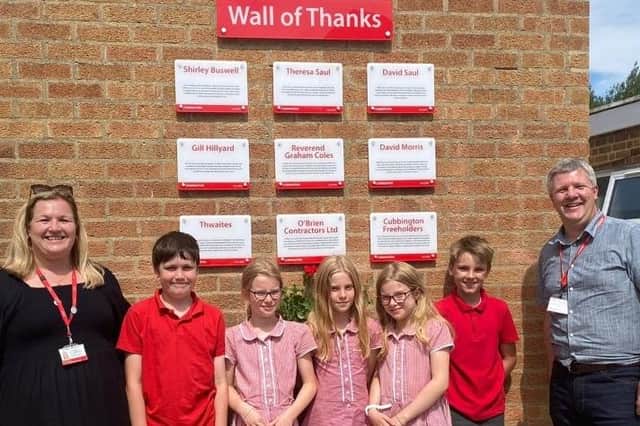 Headteacher Juliet Jones with Year 5 helpers and Nick Wylie (chair of governors)