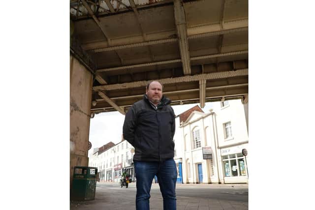 Cllr Will Roberts at the bridge over the junction of Bath Street, High Street and Clemens Street. Photo by Warwick District Council