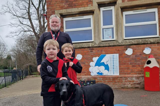 Simon White, Yelvertoft Primary School’s Business Development Manager with Ella the Dog and Angus and Dougie Fyfe.



 

Dougie Fyfe aged 4 said ‘I like having a dog at school as it is just like being at home; Ella is very gentle and friendly’. Picture: Milly Fyfe