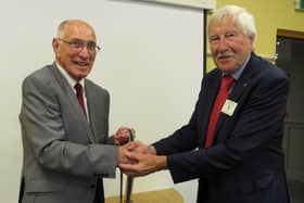President Alan Bailey (right) receives the good wishes of Keith Talbot.  Photo supplied