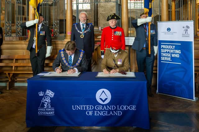 Warwickshire Freemasons recently signed the Armed Forces Covenant.  Philip Hall, Provincial Grandmaster and Lt. Col Samantha Brettell from HQ West Midlands, who signed on behalf of the MoD in the Regimental Chapel of the Royal Warwickshire Regiment in the Collegiate Church of St Mary in Warwick. Photo by Mike Baker