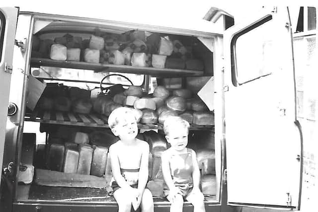 Hayley's father Martin Sabin as a child in the back of the delivery van with Hayley's uncle Paul Sabin in the 1960s. Photo supplied