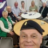 Wayne Perry helps raise funds with guests at the D-Day celebrations.