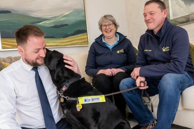Paul spending some time with Rose, along with the Guide Dogs representatives following the donation