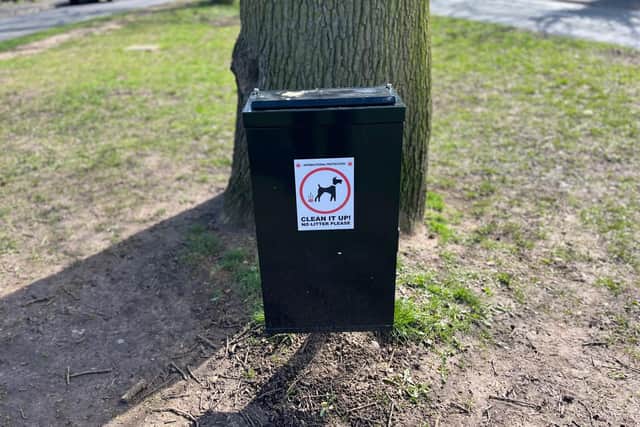 A dog bin in Rugby borough. Photo posed by model.