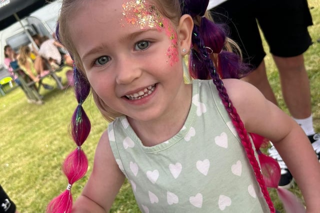 Festival-goer shows off beautiful face-painting.