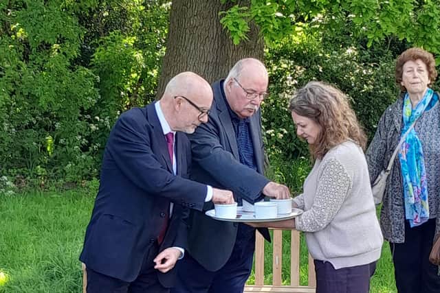 Matt Western MP plants poppy seeds near the memorial bench put in place in honour of Lilian Brocklehurst at the Sydni Centre on Saturday. Picture supplied.