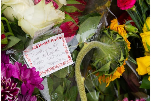 Tributes have been left outside Shire Hall in Warwick. Photo by Mike Baker
