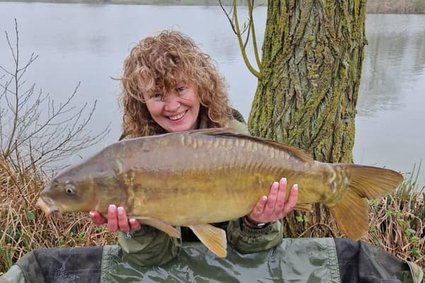 Karen Jamieson proudly displays her carp catch