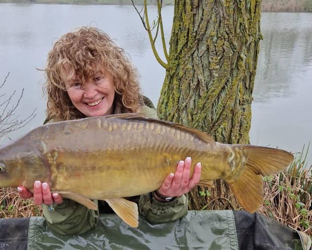 Karen Jamieson proudly displays her carp catch