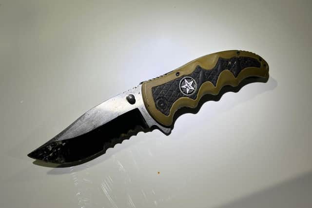 Police recovered this lock knife from Inside the vehicle