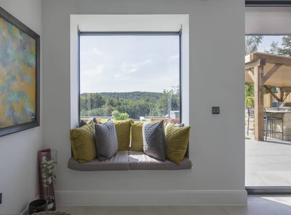 Create a cosy nook with cushions and pillows (photo: Express Bi-Folding Doors)